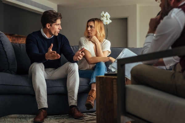 couple arguing in front of therapy center